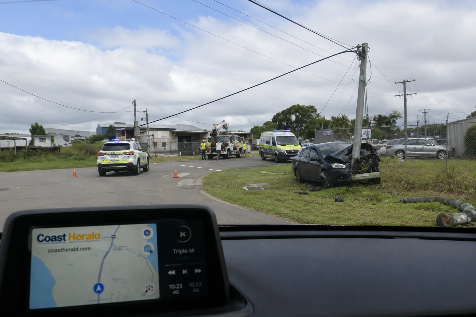 Driver freed after car hits pole at Tuggerah, cutting power