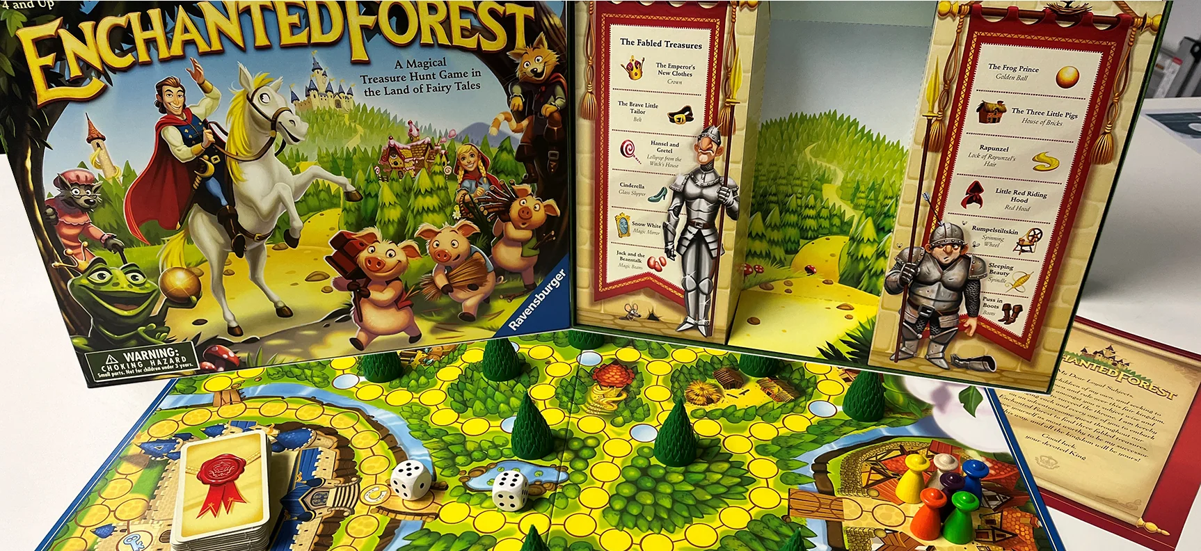 An Enchanted Forest tabletop game set up with its board, pieces and illustrated panels