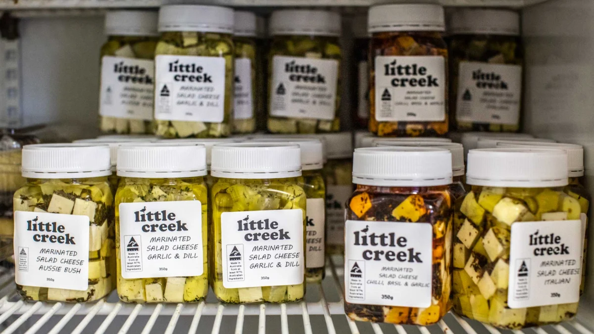 Little Creek Cheese jars of marinated salad cheese displayed in the factory outlet