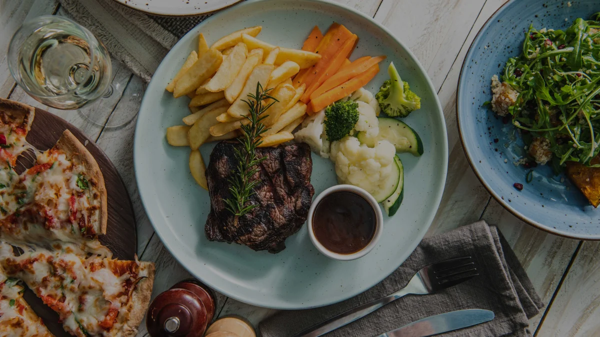 Steak, chips, vegetables, pizza and salad served at Spinners Restaurant at Club Wyong