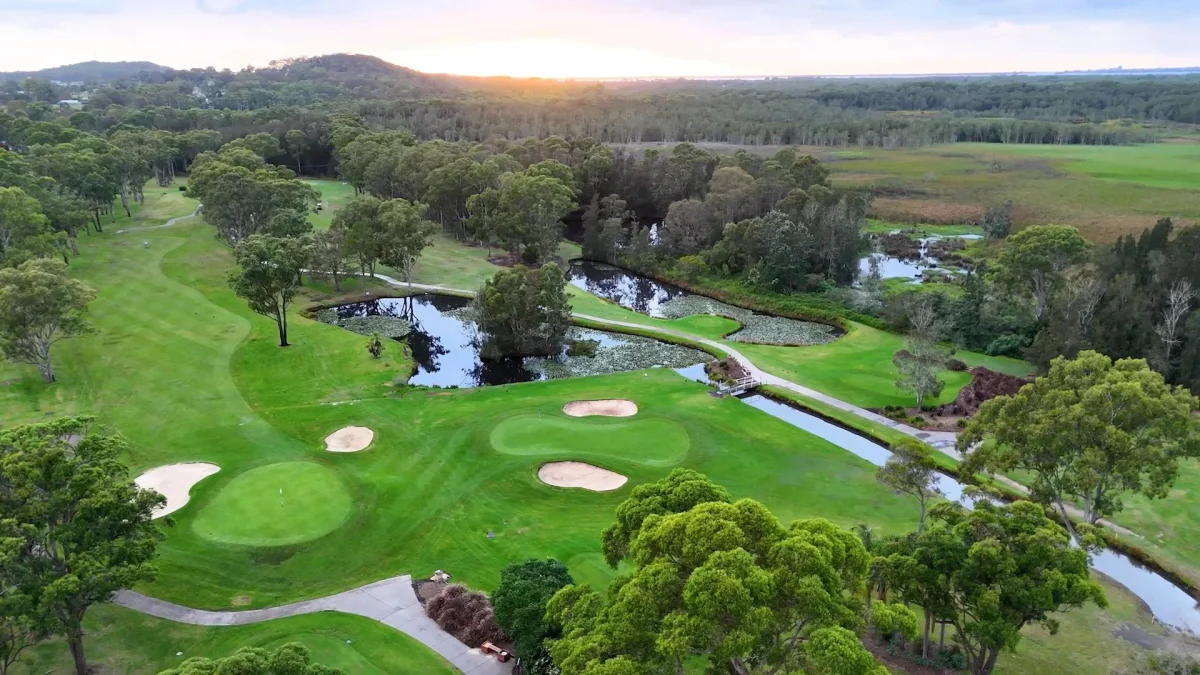 Aerial view over Wyong Golf Club fairways, greens, bunkers and waterways